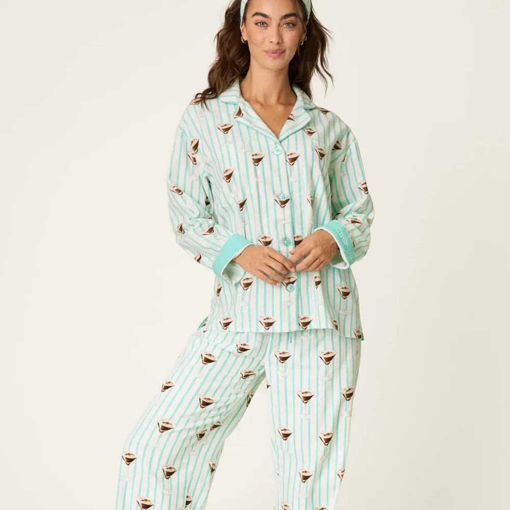 A model wearing PJ Salvage's Espresso Martini print three-piece flannel pajama set with matching headband